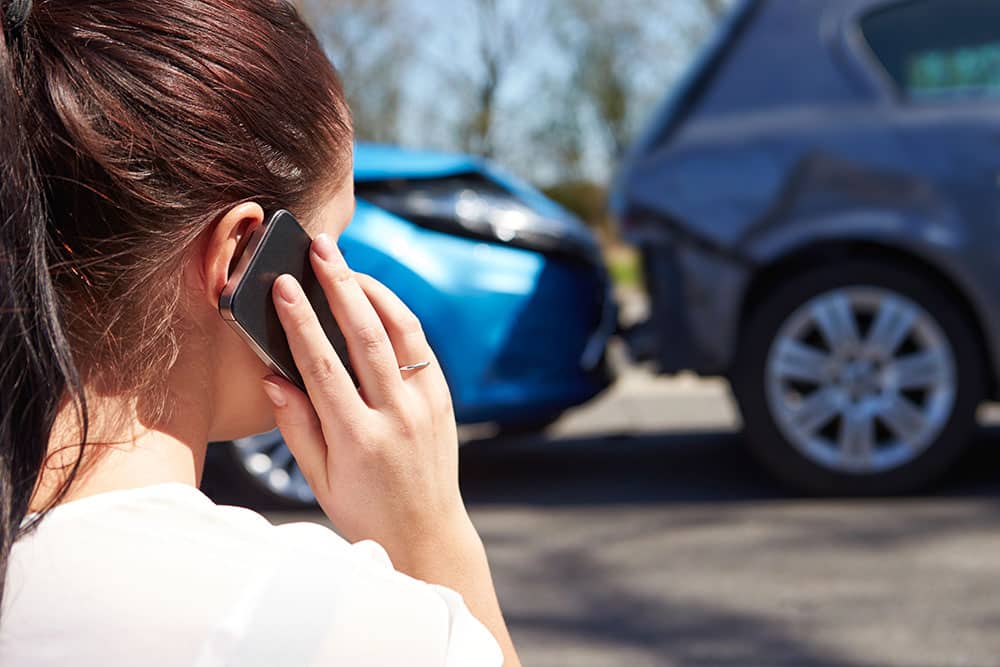 driver making phone call after an accident